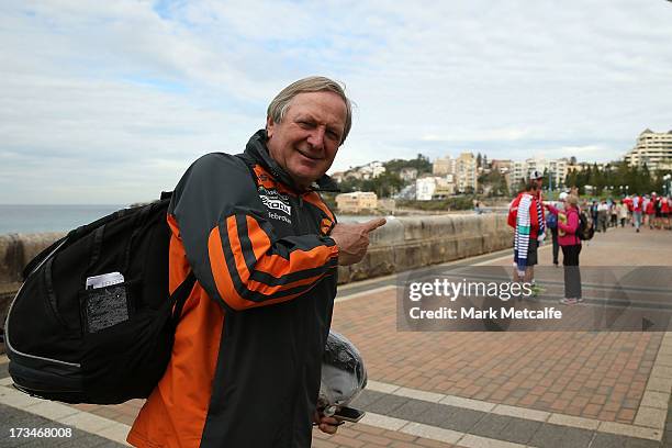 Giants coach Kevin Sheedy points towards Swans players during a Sydney Swans AFL recovery session at Coogee Beach on July 15, 2013 in Sydney,...