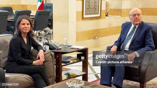 October 2023, Lebanon, Beirut: Annalena Baerbock , German foreign minister, and Najib Mikati, acting prime minister of Lebanon, sit together during...