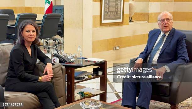 October 2023, Lebanon, Beirut: Annalena Baerbock , German foreign minister, and Najib Mikati, acting prime minister of Lebanon, sit together during...