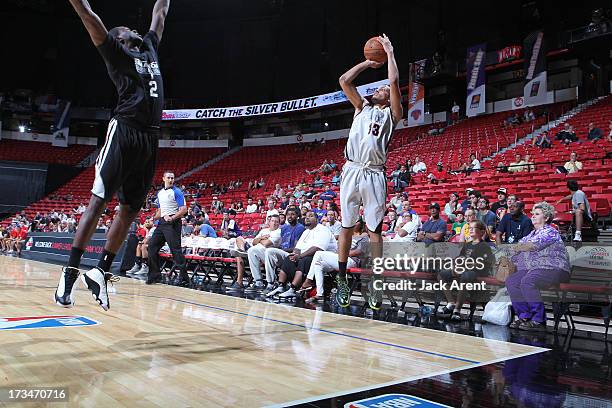 Devoe Joseph of the Toronto Raptors goes for a jump shot against Durand Scott of the San Antonio Spurs during NBA Summer League game between the...