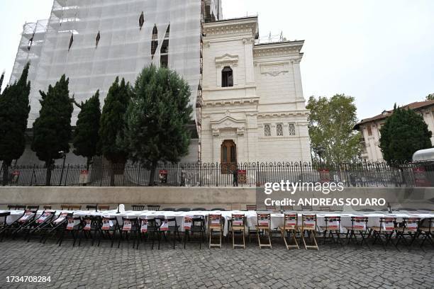 Members of the Jewish community set a giant table for 203 guests in support of the Israeli hostages in Gaza, on October 20, 2023 in front of the...