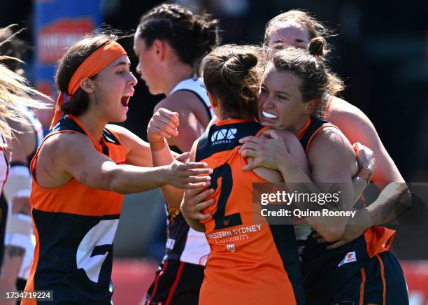 Alyce Parker of the Giants is congratulated by team mates after kicking a goal during the round seven AFLW match between St Kilda Saints and Greater...