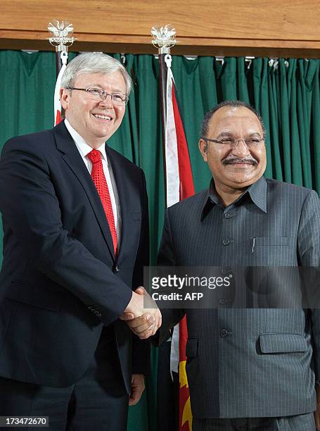 Australian Prime Minister Kevin Rudd shakes hands with Papua New Guinea's Prime Minister Peter O'Neill in Port Moresby on July 15, 2013. Australia on...