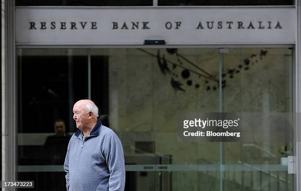Man stands outside the Reserve Bank of Australia headquarters in the central business district of Sydney, Australia, on Monday, July 15, 2013. While...