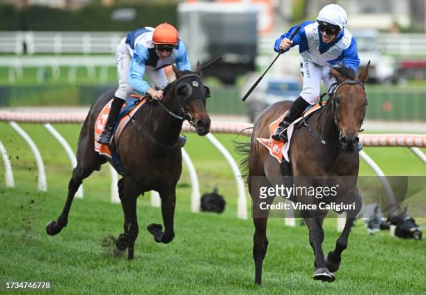 Tim Clark riding Alligator Blood winning Race 7, the Neds Might And Power, during Melbourne Racing at Caulfield Racecourse on October 14, 2023 in...
