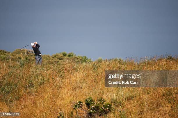 Matt Kuchar of the United States tees off on the 5th hole ahead of the 142nd Open Championship at Muirfield on July 15, 2013 in Gullane, Scotland.