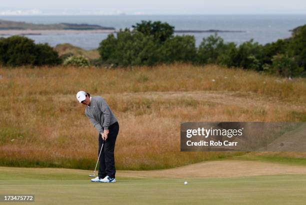 Rory McIlroy of Northern Ireland putts ahead of the 142nd Open Championship at Muirfield on July 15, 2013 in Gullane, Scotland.