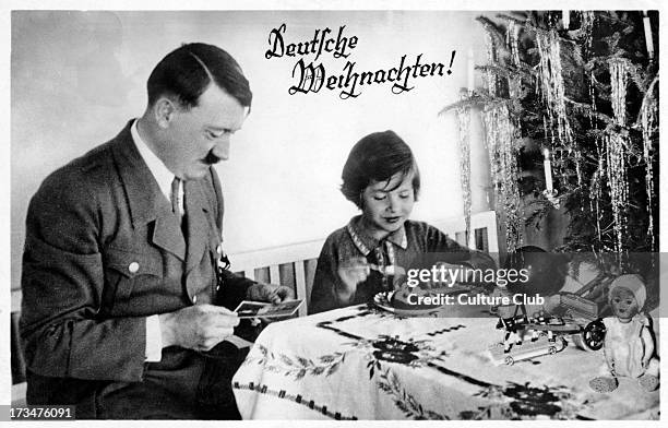 Adolf Hitler with a child. Austrian-born German politician and the leader of the National Socialist German Workers Party: 20 April 1889  30 April...