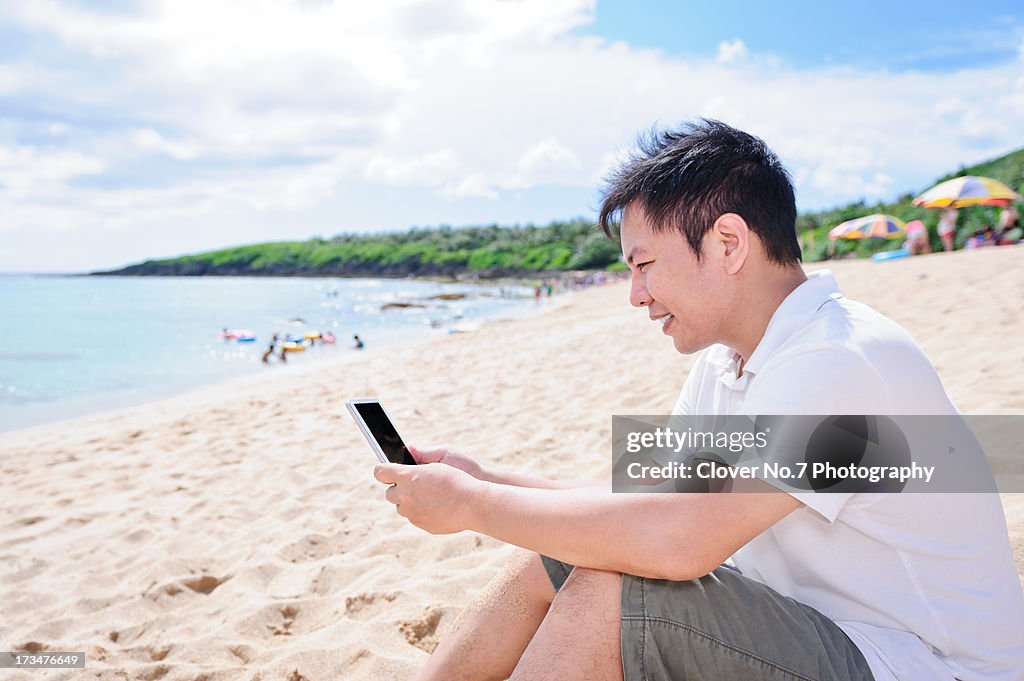 Man using digital tablet.