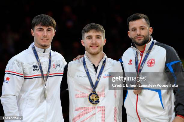 Gold medalist Harry Hepworth of Great Britain celebrates on the podium alongside silver medalist Leo Saladino of France and bronze medalist Jose...