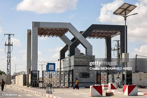 This picture taken on October 20, 2023 shows a view of the gate to the Rafah border crossing with Egypt in the southern Gaza Strip. Thousands of...