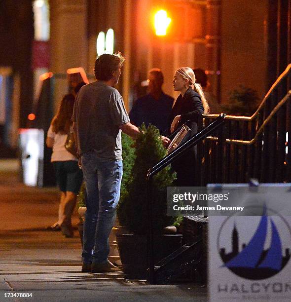 Mary-Kate Olsen and guest dine at Wolfgang's Steakhouse on July 14, 2013 in New York City.