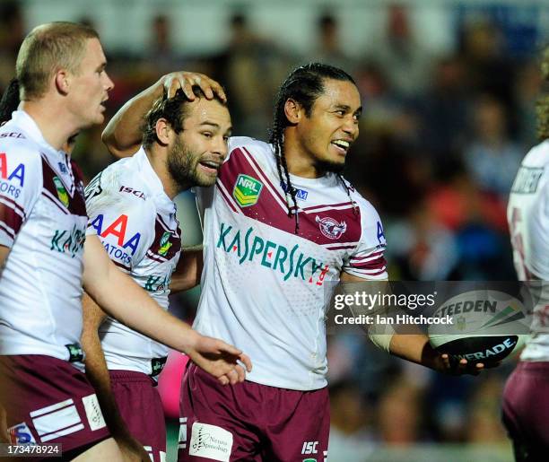 Steve Matai of the Sea Eagles celebrates with Brett Stewart after scoring a try during the round 18 NRL match between the North Queensland Cowboys...