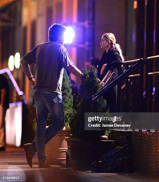 Mary-Kate Olsen and guest dine at Wolfgang's Steakhouse on July 14, 2013 in New York City.