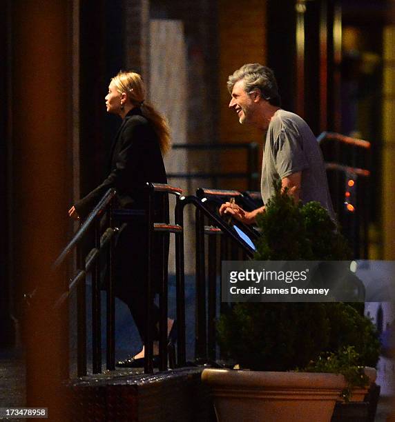 Mary-Kate Olsen and guest dine at Wolfgang's Steakhouse on July 14, 2013 in New York City.