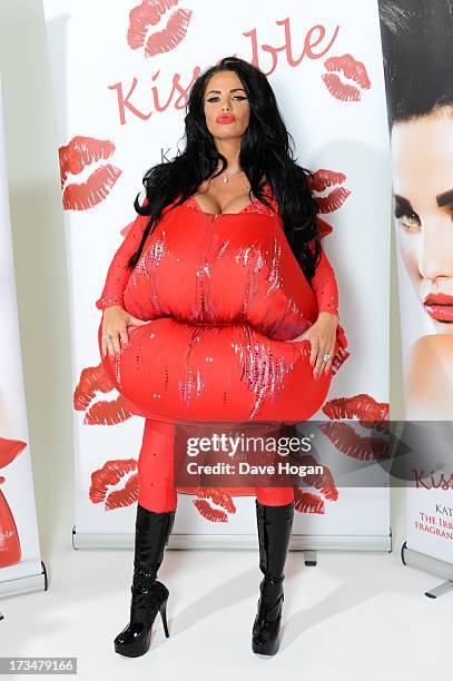 Katie Price poses as she launches her new fragrance 'Kissable' at The Work Studios on July 4, 2013 in London, England.