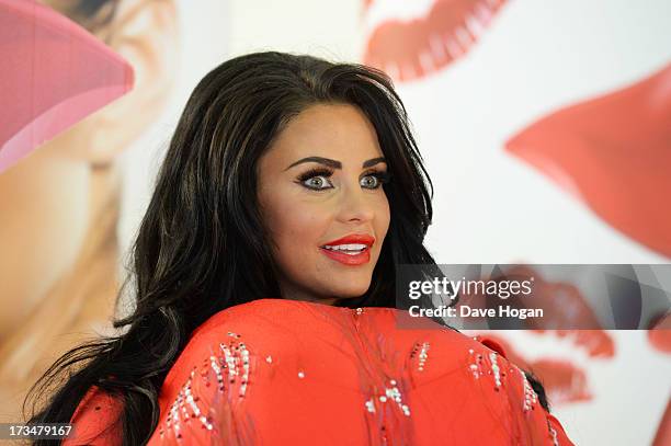 Katie Price poses as she launches her new fragrance 'Kissable' at The Work Studios on July 4, 2013 in London, England.