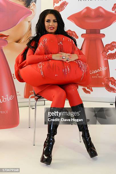 Katie Price poses as she launches her new fragrance 'Kissable' at The Work Studios on July 4, 2013 in London, England.