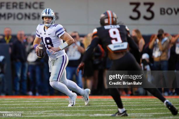 Quarterback Will Howard of the Kansas State Wildcats looks to throw against safety Trey Rucker of the Oklahoma State Cowboys in the first quarter at...