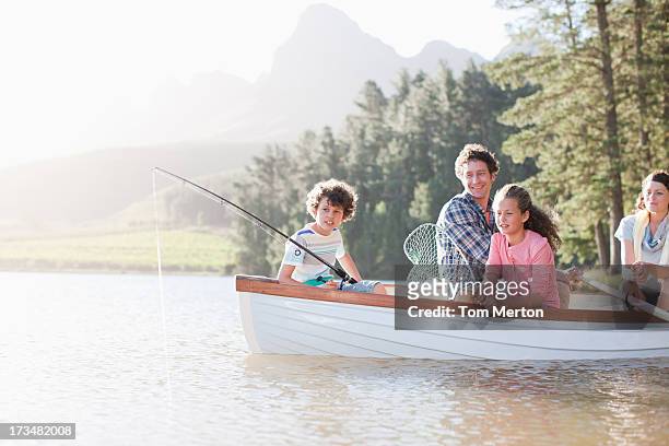 family fishing in boat on lake - 11 loch stock pictures, royalty-free photos & images