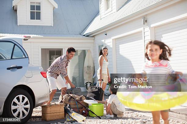 girl with inflatable ring running in driveway - tube girl bildbanksfoton och bilder