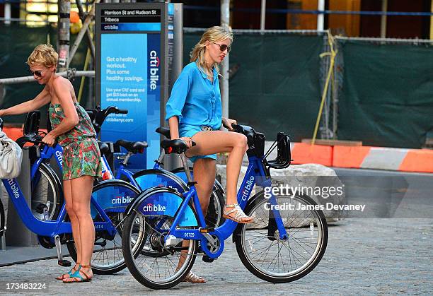 Karolina Kurkova rides a CitiBike on the streets of Manhattan on July 14, 2013 in New York City.