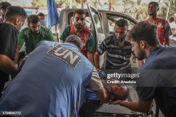 United Nations workers are brought to the Nassr Hospital after being injured in Israeli attacks in Khan Yunis, Gaza on October 19, 2023. The UN...