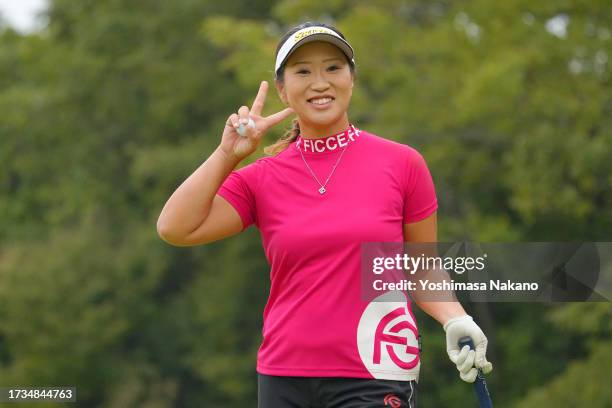 Sakura Kito of Japan poses after holing out with the birdie on the 18th green during the second round of Udon-Ken Ladies Golf Tournament at Mannou...