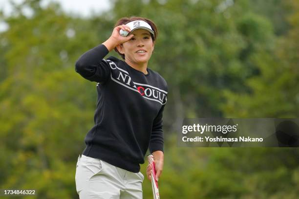 Yoko Ogawa of Japan acknowledges the gallery after holing out with the birdie during the second round of Udon-Ken Ladies Golf Tournament at Mannou...