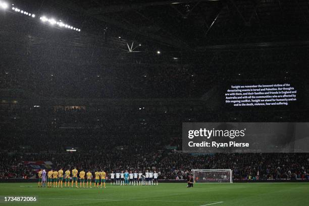 Players, fans and match officials observe a minutes silence in remembrance of the victims of last weekends attacks in Israel prior to the...