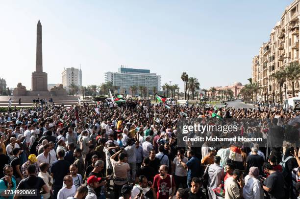 Demonstrators shout slogans during a protest in support of the Palestinian people, in the Gaza Strip, at Tahrir Square, on October 20, 2023 in Cairo,...