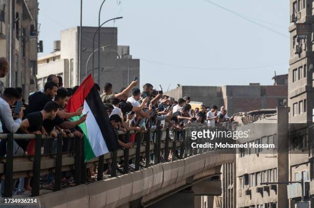 Demonstrators shout slogans during a protest in support of the Palestinian people, in the Gaza Strip, in a rally to Tahrir Square, on October 20,...