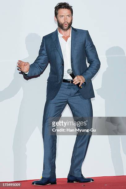 Actor Hugh Jackman dances to a song by South Korean rapper Psy 'The Wolverine' South Korea Premiere at COEX Mega Box on July 15, 2013 in Seoul, South...