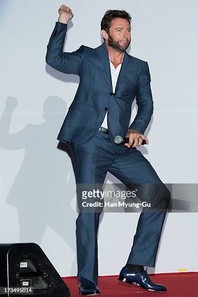 Actor Hugh Jackman dances to a song by South Korean rapper Psy 'The Wolverine' South Korea Premiere at COEX Mega Box on July 15, 2013 in Seoul, South...