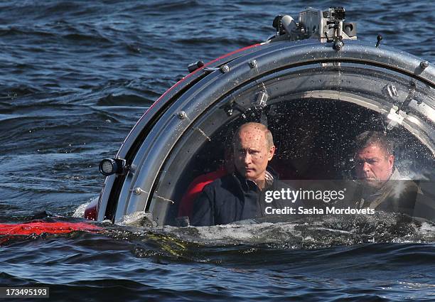 Russian President Vladimir Putin rides in a submersible July 15, 2013 in the Baltic Sea near Gotland Island, Russia. The vessel dove to the sea floor...