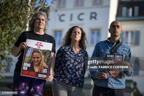 Relatives of Israelis missing or held hostages by the Hamas Michal Dorset showing a picture of her niece Romi Gonen, Doris Liber representing her son...
