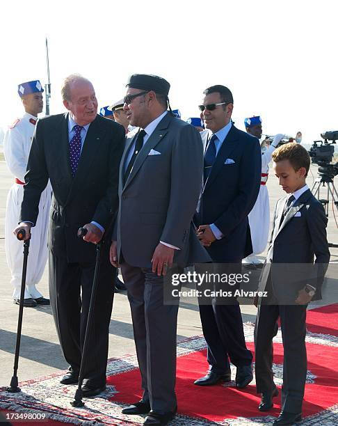 King Mohammed VI of Morocco , his son and Crown Prince Moulay El Hassan and King's brother Prince Moulay Rachid receive King Juan Carlos of Spain at...