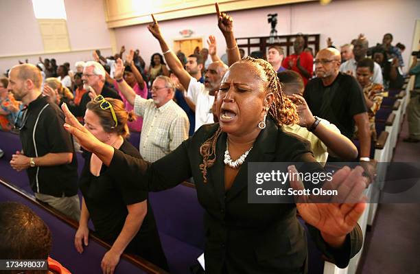 Residents of Sanford, Florida attend a prayer vigil to promote peace and unity in the community in the wake of the George Zimmerman trial on July 15,...