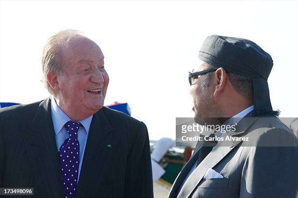 King Mohammed VI of Morocco receives King Juan Carlos of Spain at the Rabat Sale airport on July 15, 2013 in Rabat, Morocco. King Juan Carlos of...
