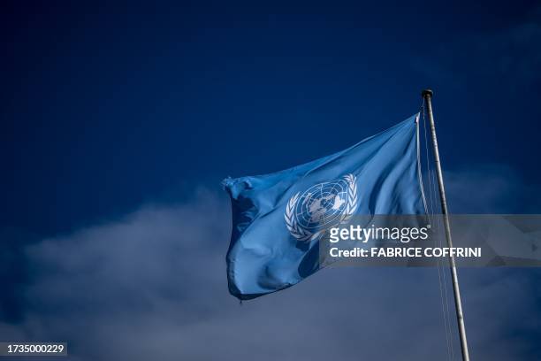 Flag of the United Nations flutters at the main entrance of the "Palais des Nations" building which houses the United Nations Office at Geneva, on...
