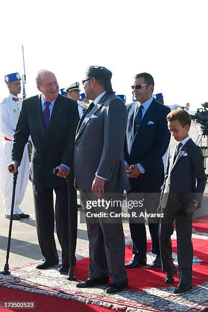 King Mohammed VI of Morocco , his son and Crown Prince Moulay El Hassan and King's brother Prince Moulay Rachid receive King Juan Carlos of Spain at...