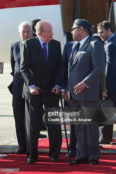 King Mohammed VI of Morocco receives King Juan Carlos of Spain at the Rabat Sale airport on July 15, 2013 in Rabat, Morocco. King Juan Carlos of...