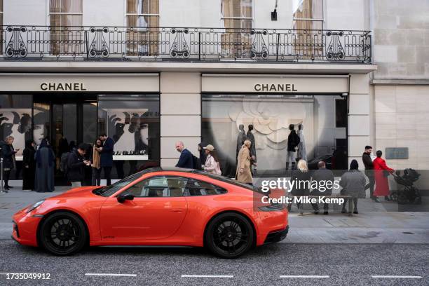 High end Porsche 911 Carrrera GTS car parked outside the Chanel store on Bond Street on 16th October 2023 in London, United Kingdom. Bond Street is...