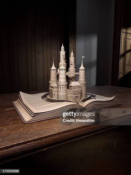 castle popping up from an old book - cuento de hadas fotografías e imágenes de stock