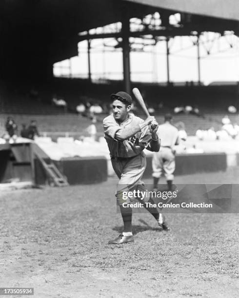 Hazen S. Cuyler of the Chicago Cubs swinging a bat in 1930.