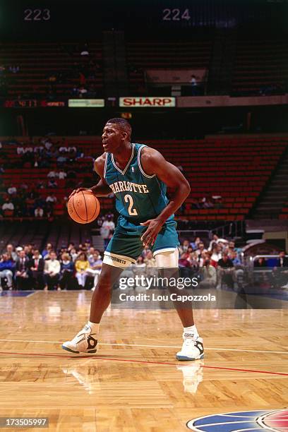 Larry Johnson of the Charlotte Hornets handles the ball against the New Jersey Nets during a game played circa 1991 at Brendan Byrne Arena in East...