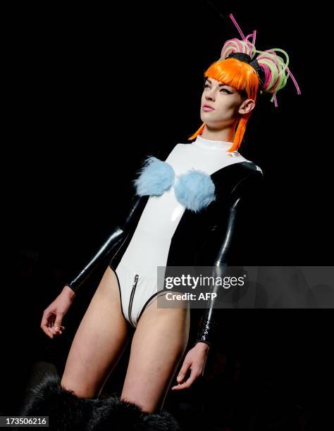 Model presents a creation by designer Esther Meijer during the 19th Amsterdam Fashion Week, on July 15, 2013 in Amsterdam. The fashion event runs...