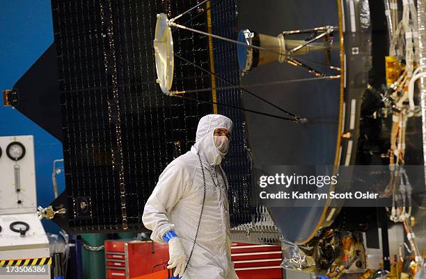Lockheed Martin engineer Jack Farmerie is preparing to remove the primary high gain antennae from the MAVEN spacecraft for transport. The NASA MAVEN...