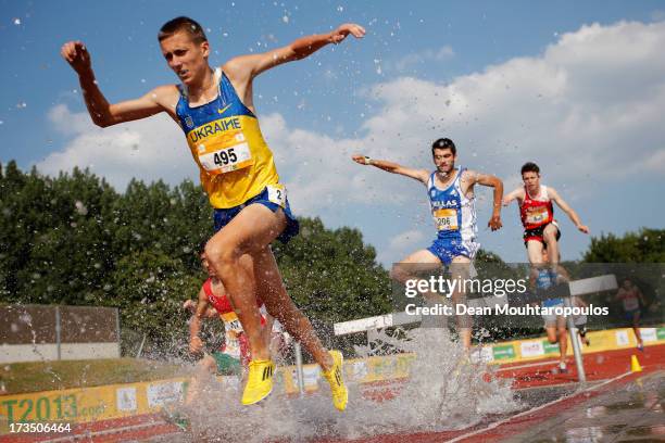 Maksym Pasievin of Ukraine, Themistoklis Evangelos Milas of Greece and Marc Bill of Switzerland compete in the 2000m Boys steeple race during the...