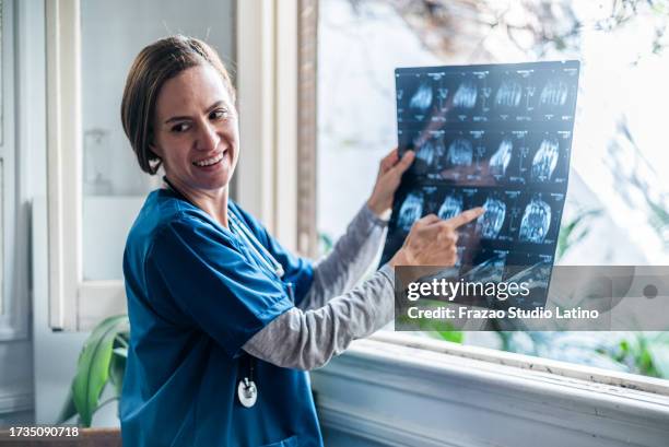 doctor analyzing a patient x-ray image - radiologist stock pictures, royalty-free photos & images